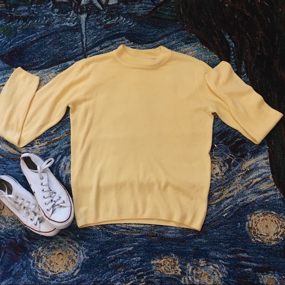 Soft pastel yellow sweater
